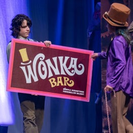 child actors holding wonka chocolate bar